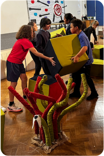 an image of participants moving a foam block during the workshop of Lose the Path, Find Your Way to create their own imaginary world